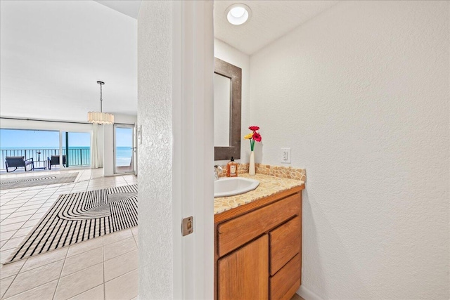 bathroom with oversized vanity and tile floors