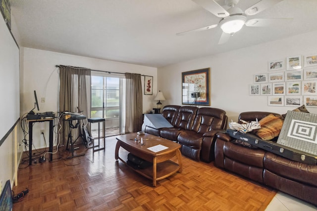 living room with ceiling fan and parquet floors