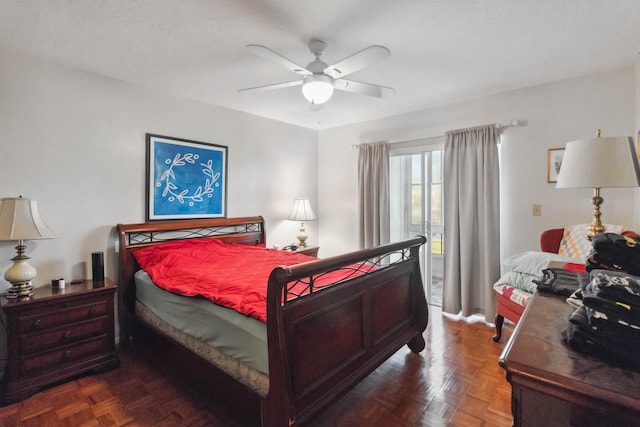 bedroom featuring ceiling fan and dark parquet floors