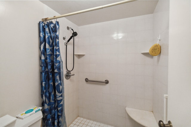 bathroom with walk in shower and toilet