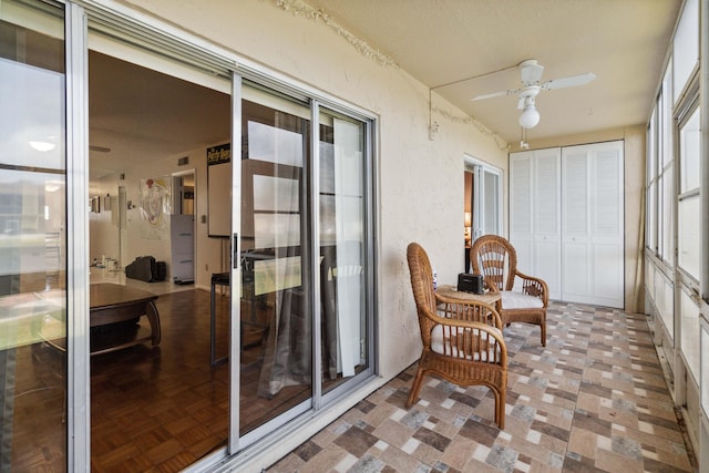 sunroom / solarium with ceiling fan