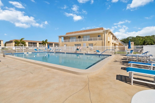 view of swimming pool with a patio area