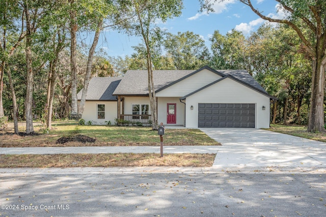 view of front facade with a front yard and a garage