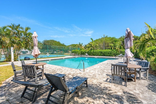 view of pool featuring a patio