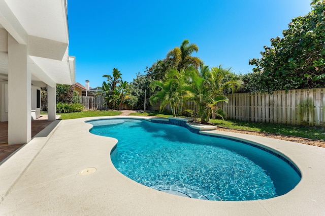 view of swimming pool with a patio area