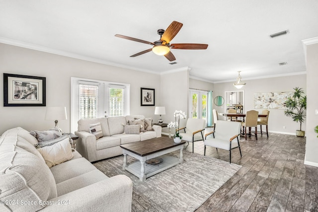 living room featuring ceiling fan, dark wood-type flooring, and ornamental molding