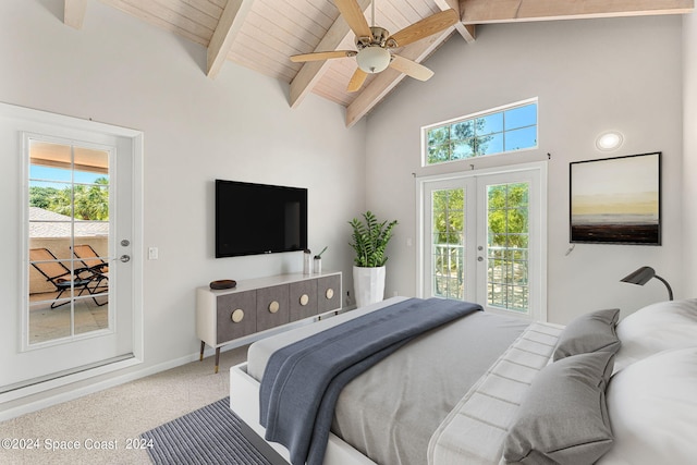 bedroom featuring access to exterior, carpet floors, and beamed ceiling