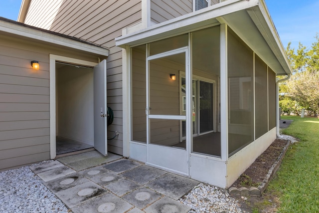 view of side of property featuring a sunroom