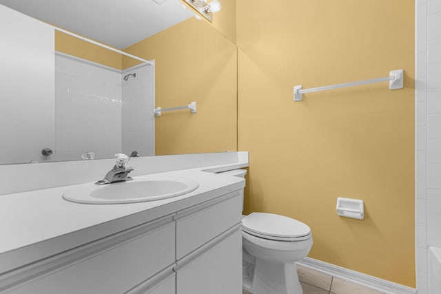 full bath featuring tile patterned flooring, vanity, toilet, and baseboards