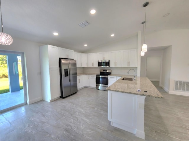 kitchen featuring lofted ceiling, stainless steel appliances, kitchen peninsula, and light tile flooring