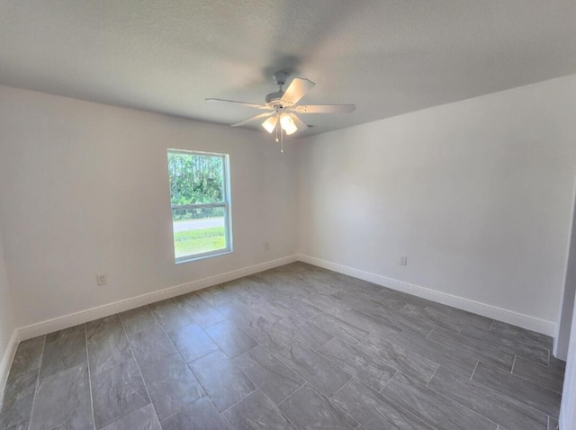 spare room with ceiling fan