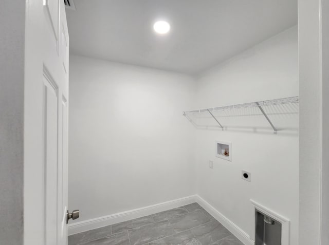 laundry room with electric dryer hookup, hookup for a washing machine, and tile flooring