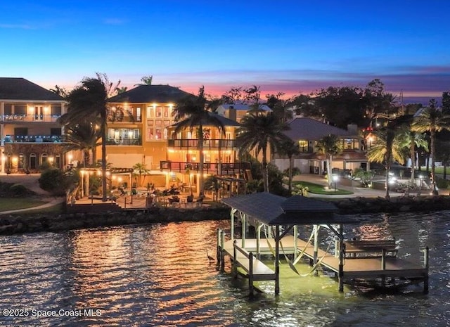 view of dock with a water view and boat lift