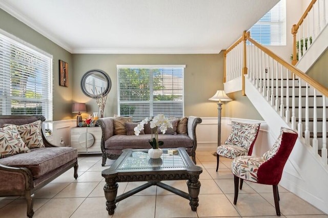 living room with ornamental molding and tile flooring