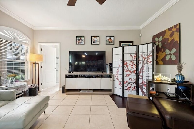 tiled living room with ornamental molding and ceiling fan