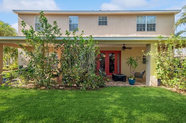 exterior space with french doors, ceiling fan, and a front yard