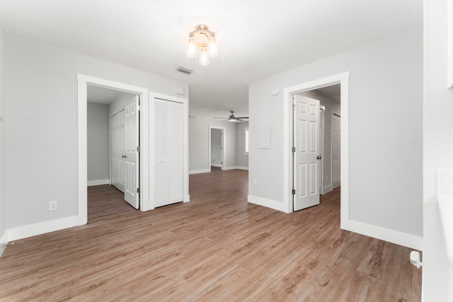 unfurnished room featuring wood-type flooring and ceiling fan