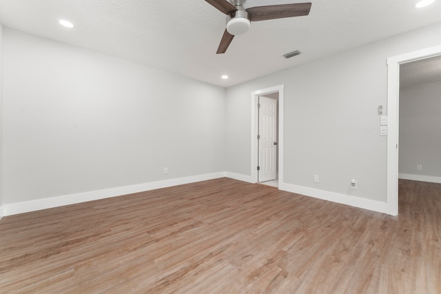 empty room featuring wood-type flooring and ceiling fan