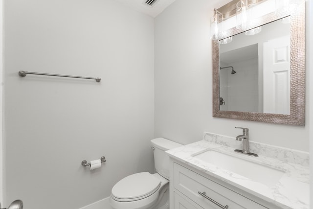 bathroom featuring oversized vanity and toilet