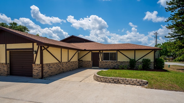 view of front facade with a front lawn and a garage