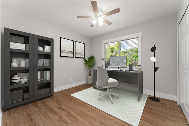 office space with ceiling fan and hardwood / wood-style flooring