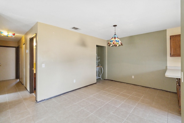 empty room featuring light tile flooring