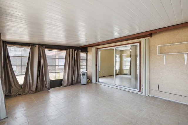 unfurnished room featuring tile flooring