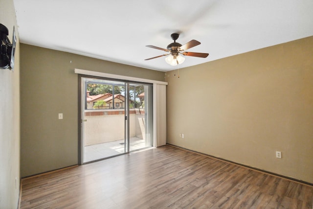 unfurnished room featuring hardwood / wood-style floors and ceiling fan