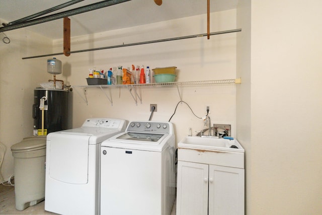 laundry area with sink, hookup for an electric dryer, water heater, and washing machine and dryer