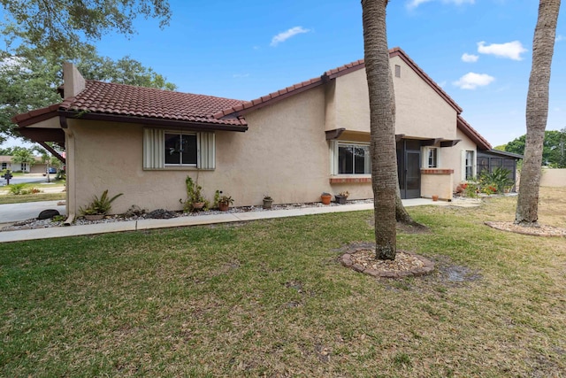 view of home's exterior featuring a lawn