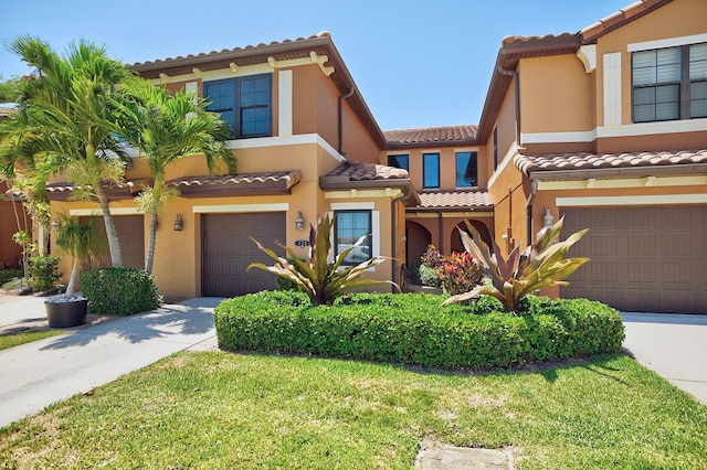 mediterranean / spanish house featuring a garage