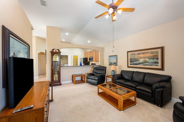 carpeted living room featuring ceiling fan and lofted ceiling