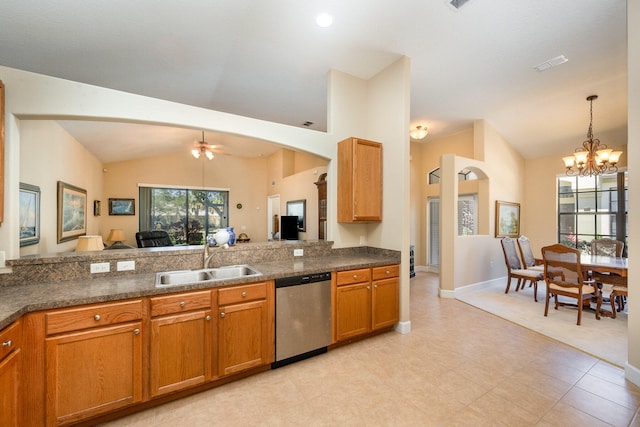 kitchen featuring sink, light tile flooring, stainless steel dishwasher, decorative light fixtures, and vaulted ceiling