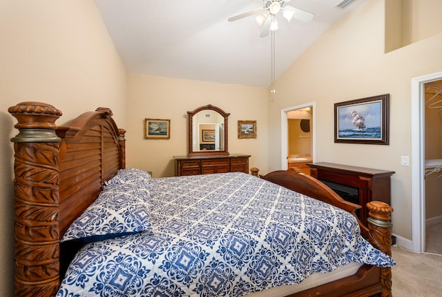 bedroom with carpet flooring, high vaulted ceiling, connected bathroom, and ceiling fan