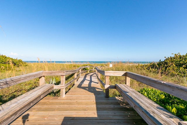 wooden deck with a water view