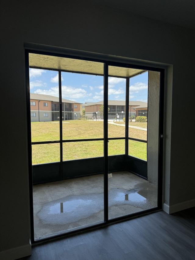 doorway featuring dark hardwood / wood-style floors