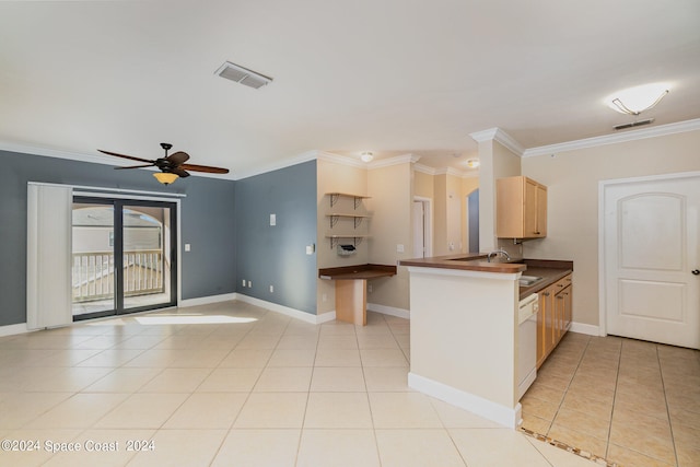 kitchen with kitchen peninsula, crown molding, light brown cabinets, and ceiling fan