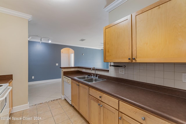 kitchen with white appliances, backsplash, sink, and ornamental molding