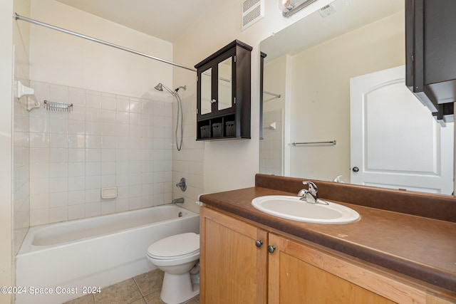 full bathroom with tile patterned floors, vanity, toilet, and tiled shower / bath combo