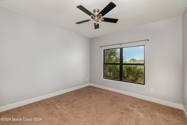 unfurnished room with carpet floors and ceiling fan