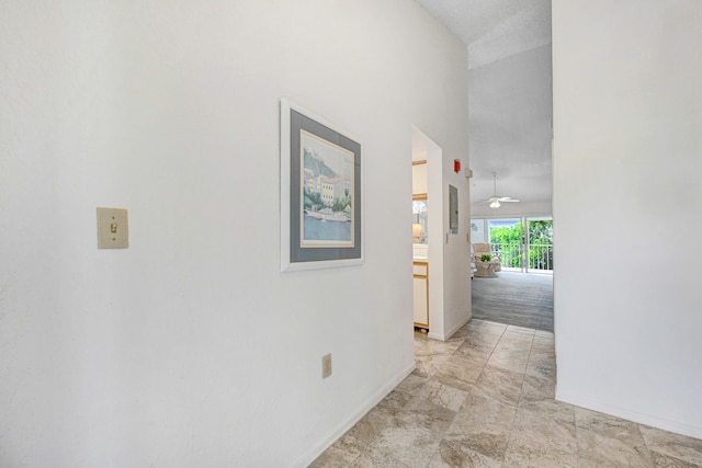 corridor with light tile floors