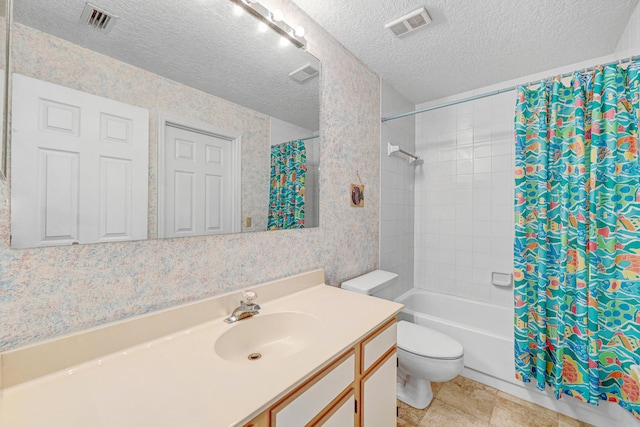 full bathroom featuring shower / bath combo, toilet, tile flooring, a textured ceiling, and vanity