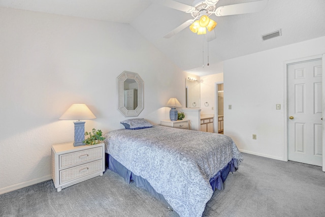 carpeted bedroom with connected bathroom, lofted ceiling, and ceiling fan