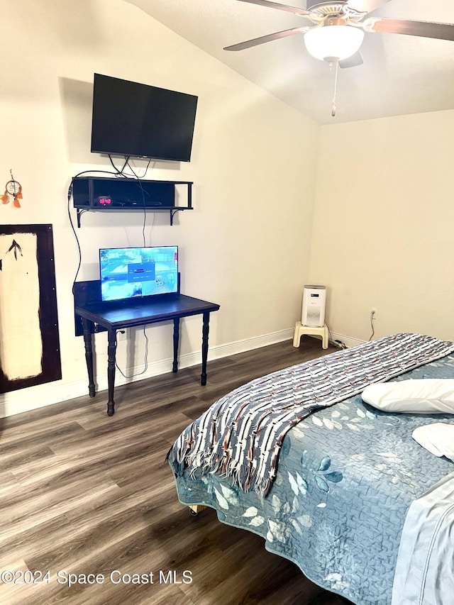 bedroom with ceiling fan, lofted ceiling, and hardwood / wood-style flooring