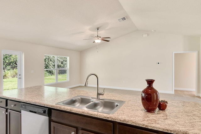 kitchen featuring dishwasher, lofted ceiling, sink, ceiling fan, and dark brown cabinets