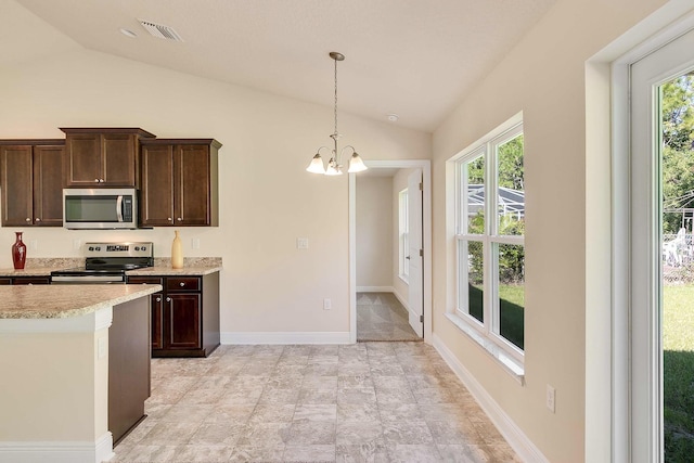 kitchen with appliances with stainless steel finishes, lofted ceiling, dark brown cabinetry, and a notable chandelier