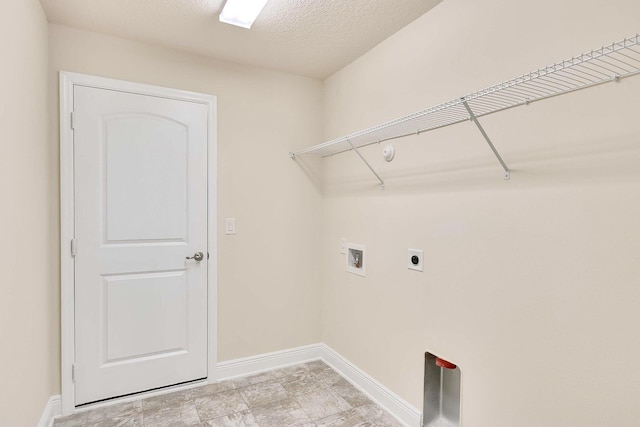 laundry area featuring washer hookup, a textured ceiling, and hookup for an electric dryer