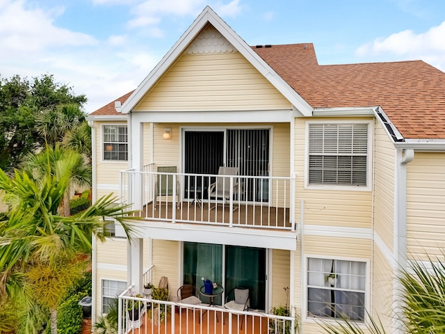 rear view of property with a balcony