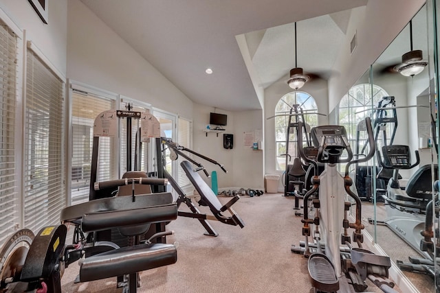 gym featuring high vaulted ceiling, carpet, and ceiling fan