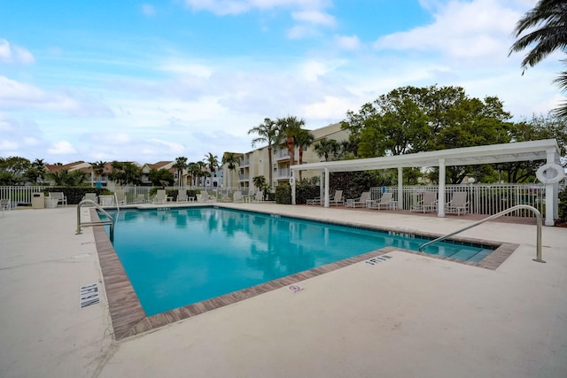 view of swimming pool with a patio area